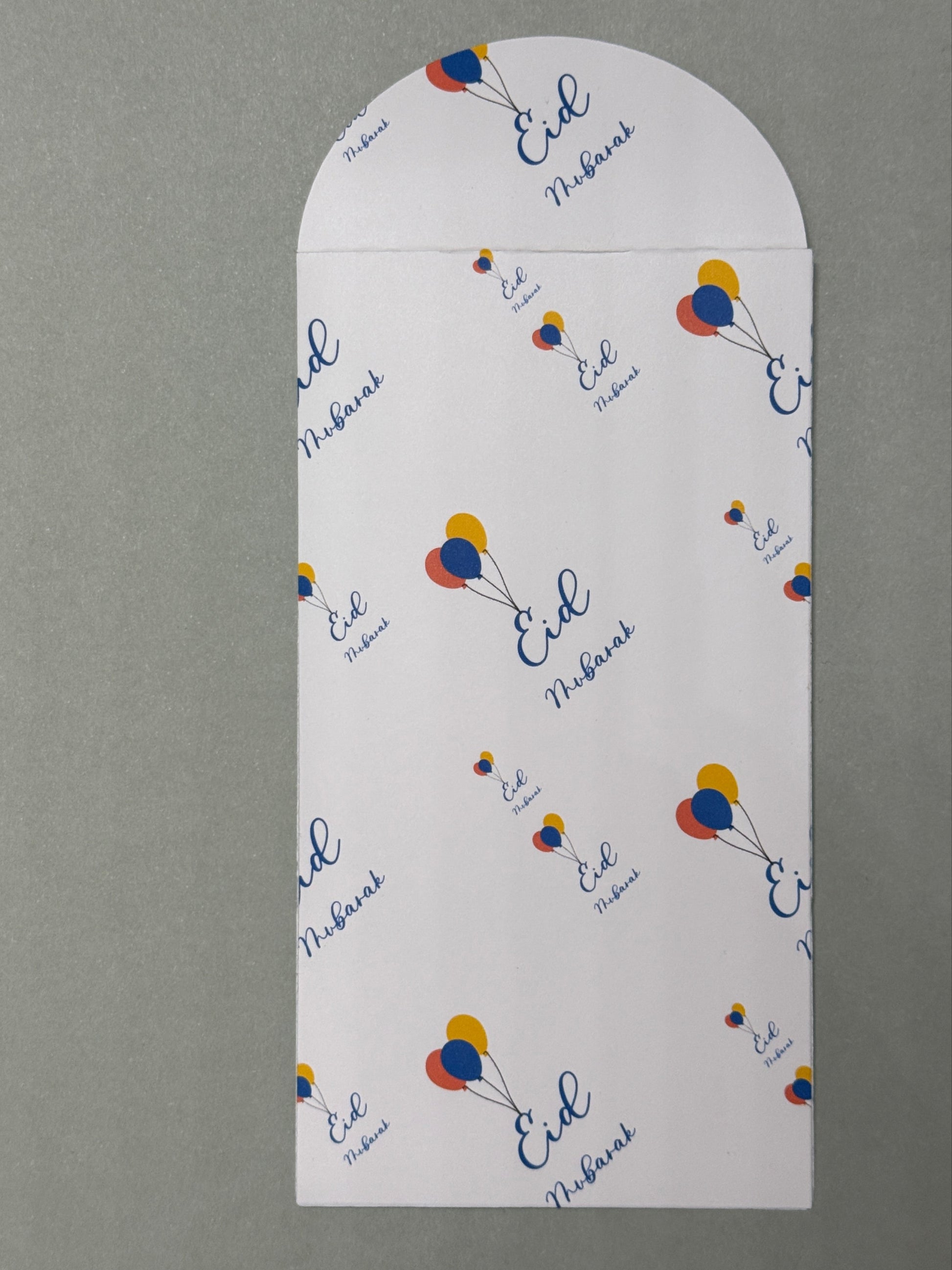 Eid Mubarak money envelope with tri colored balloons connected to the E